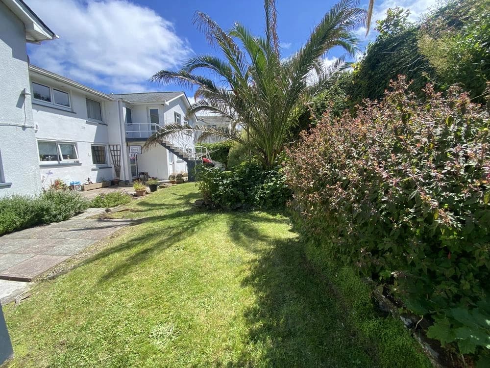 Well-maintained commercial lawn and garden outside a business property