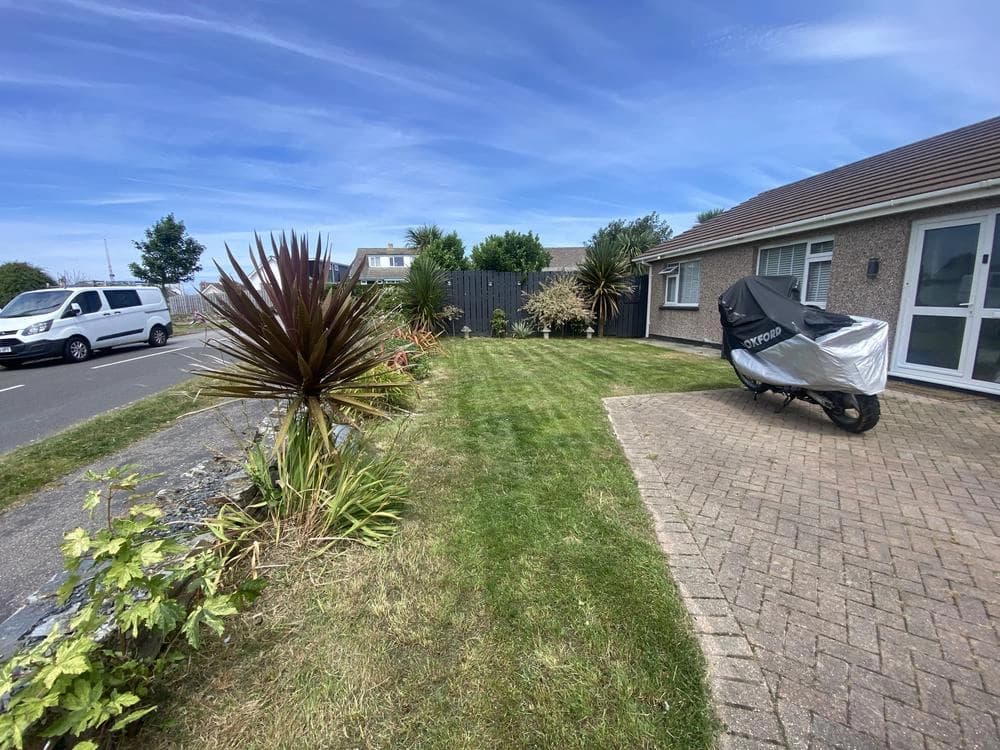Beautifully maintained residential lawn with defined edges and lush grass