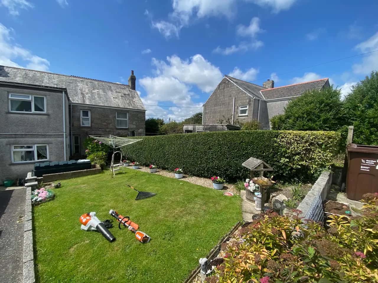 Freshly mown lawn with trimmed hedges in a private garden