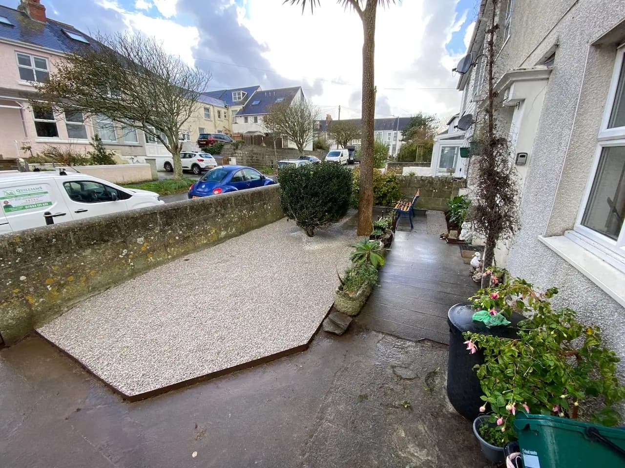 Freshly maintained garden with trimmed hedges and a neat lawn
